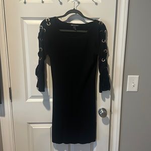 Sweater dress that flares at bottom with arm braiding in velvet with gold rings